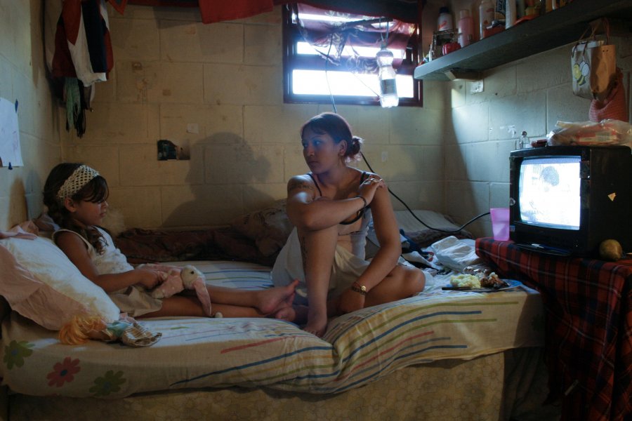 Silvia Rodas, who was convicted of robbery and attempted homicide when she was 19, talks with her daughter Anahi, 4, inside her cell at the Unidad 33 prison in Los Hornos, Argentina in this photo.