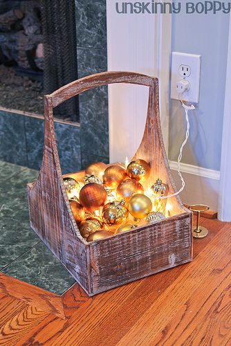 Christmas lights and balls in a basket. Any decent bowl, especially glass will give you a completely different look. A glass bowl will also give you more light. Works well with pine cones too. Love this idea!!!