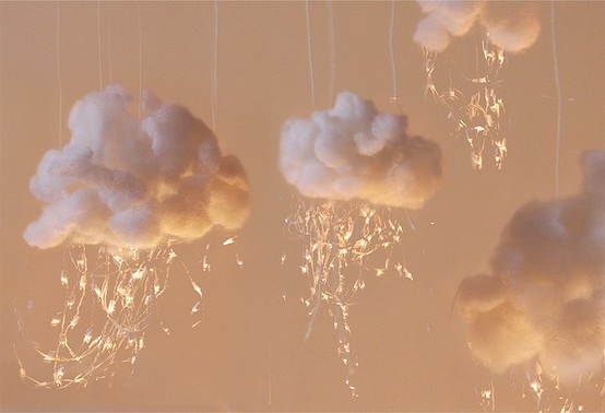 Hang icicle lights from fluffy cloud sculptures.