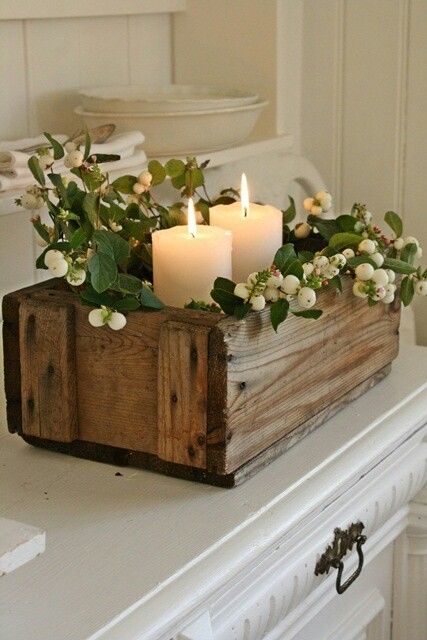 Simple and rustic centerpiece. Wood box, greenery, and candles. Lovely for a shower, wedding, or dinner party.