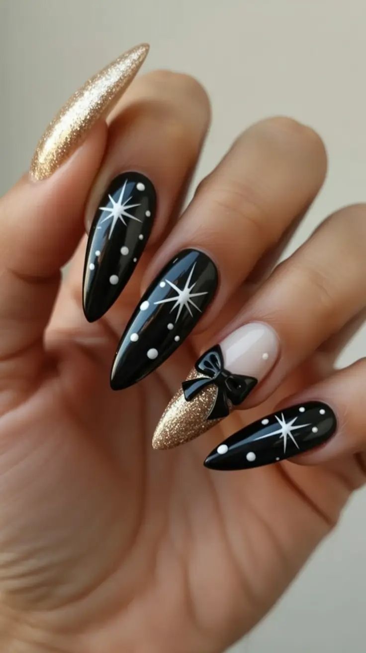 μαύρα-νύχια-με-χρυσό γκλίτερ-και-φιογκάκια-