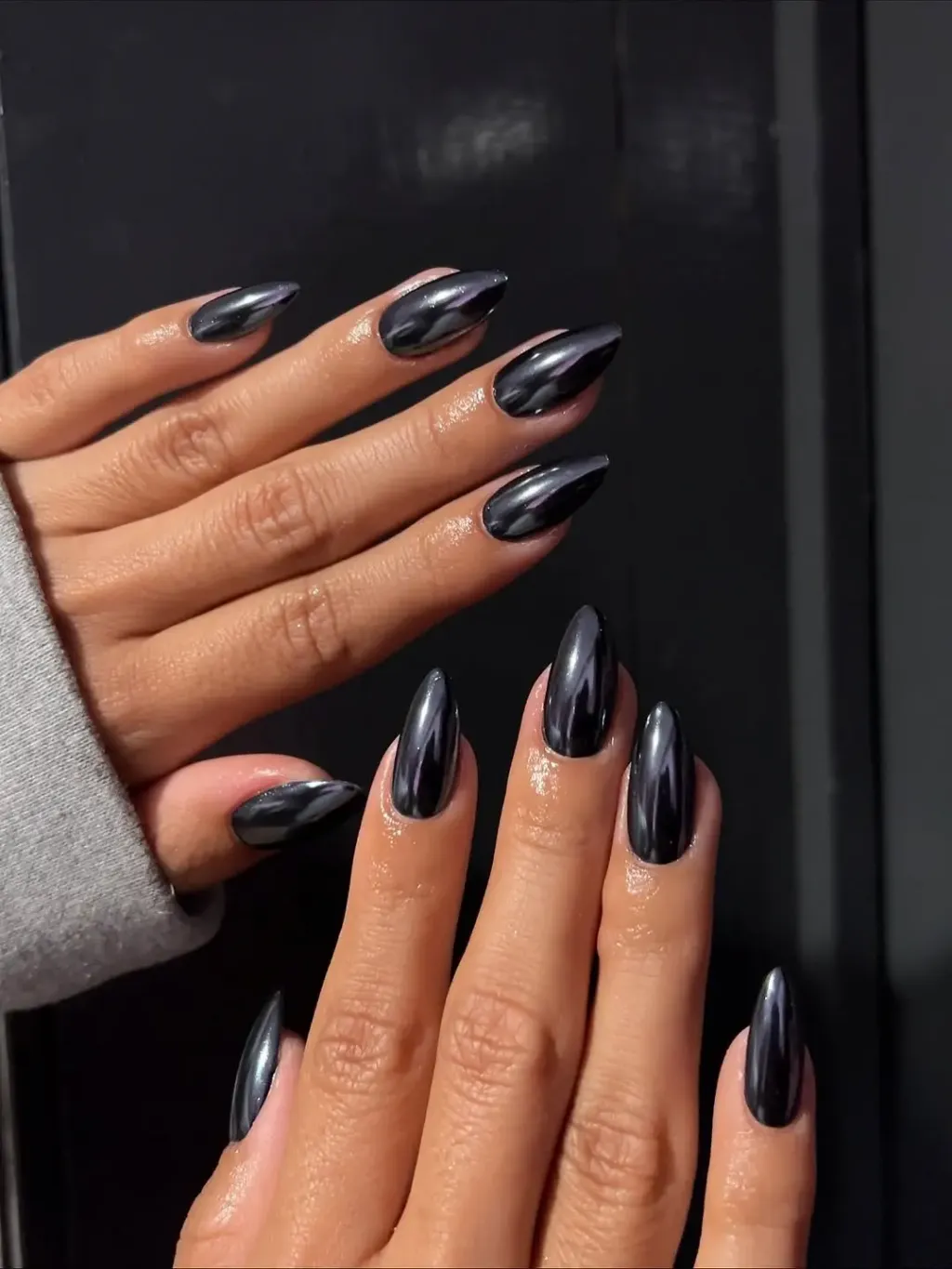 edgy almond metallic black nails webp
